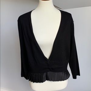 Sleek peplum cardigan sweater